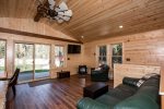 Enjoy the view out of the large windows that lead out to the custom deck